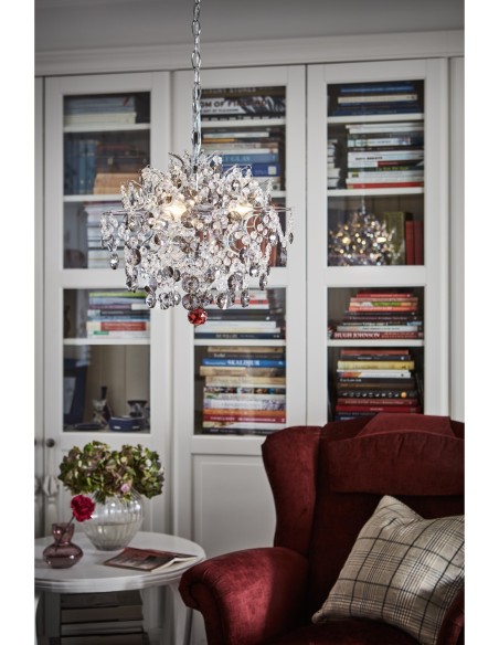 Structure en fer chromé et câble transparent, idéal pour un salon ou une salle à manger élégante.