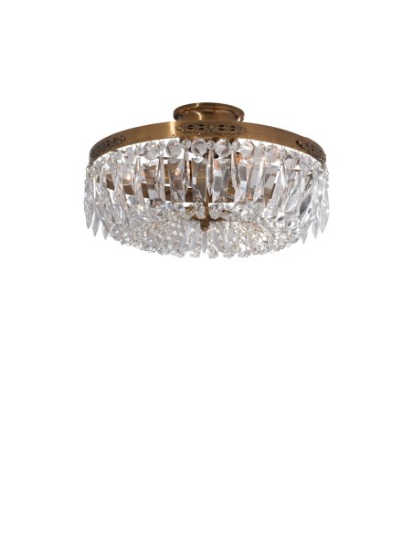 Plafonnier Strömsholm en laiton antique avec prismes taillés, lumière raffinée et vintage chic.