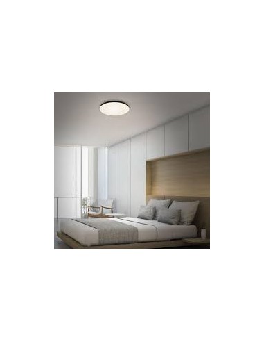 Plafonnier LED Cumbuco II noir installé dans salon moderne éclairage homogène