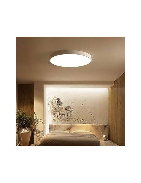 Plafonnier LED Cumbuco II blanc installé dans salon lumineux contemporain